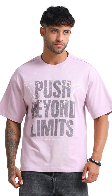 Man wearing a pink t-shirt with 'Push Beyond Limits' text on a white background