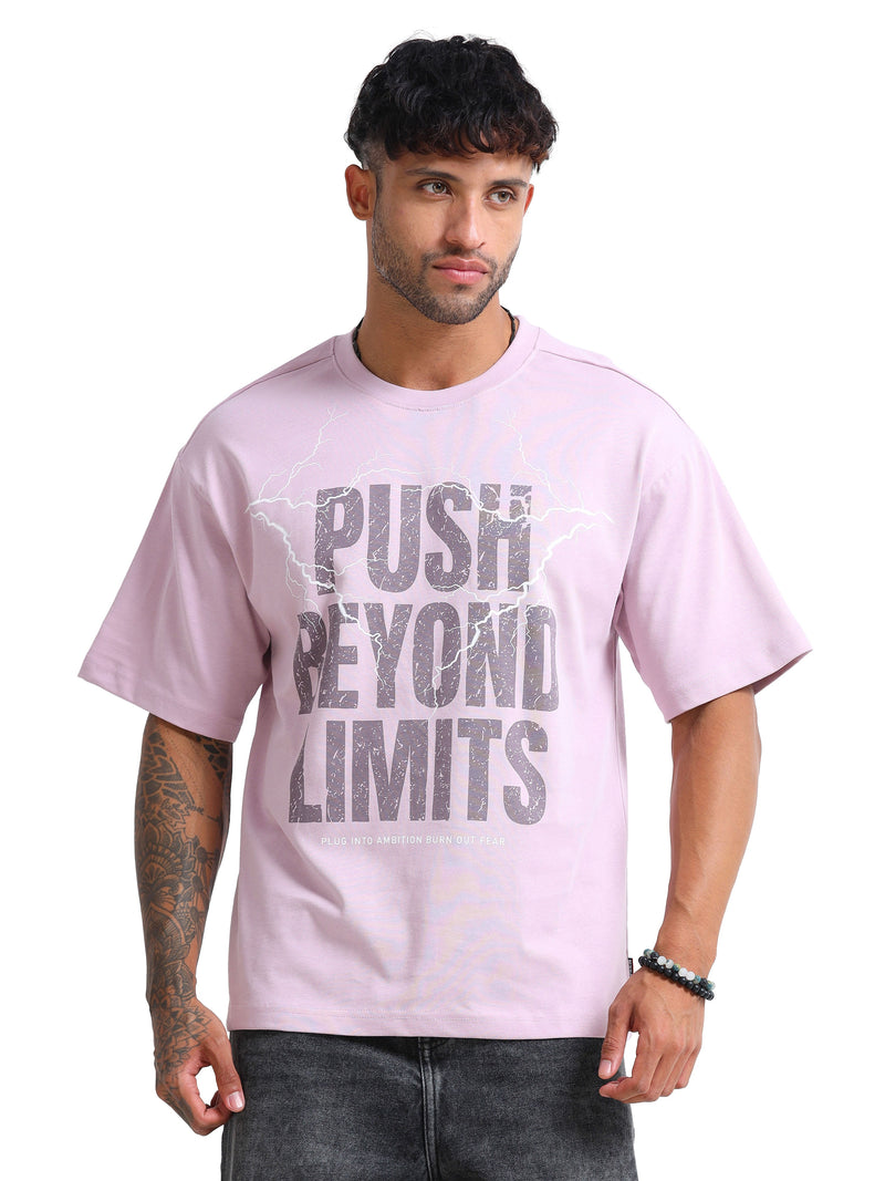 Man wearing a pink t-shirt with 'Push Beyond Limits' text on a white background