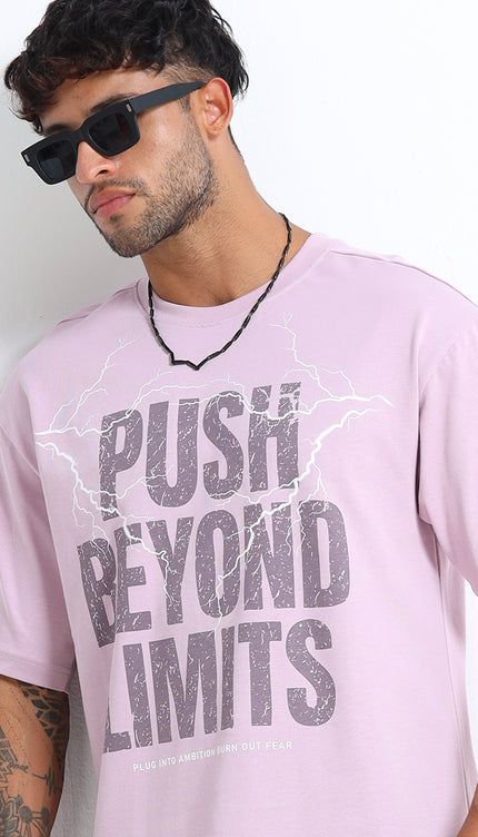 Man wearing a pink t-shirt with 'Push Beyond Limits' text against a white background