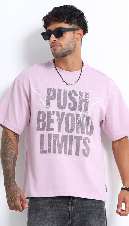 Man wearing a light purple t-shirt with 'Push Beyond Limits' text, sunglasses, and black pants on a white background.