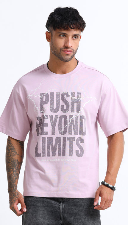 Man wearing a pink t-shirt with 'Push Beyond Limits' text on a white background