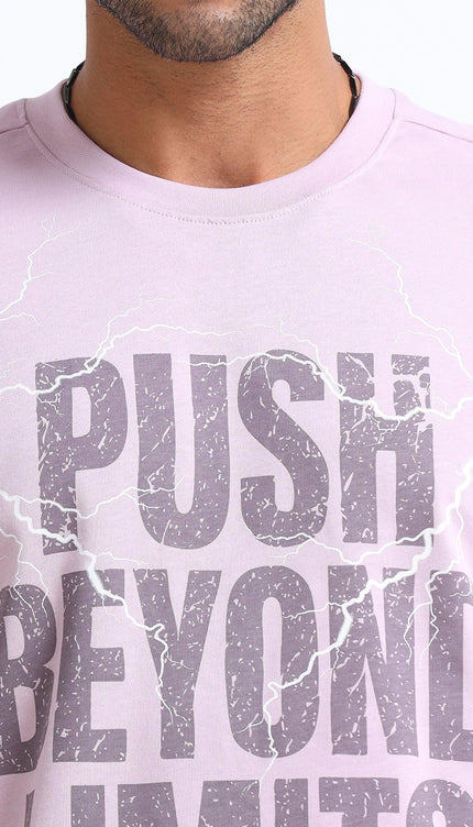 Person wearing a light purple t-shirt with 'Push Beyond Limits' text.