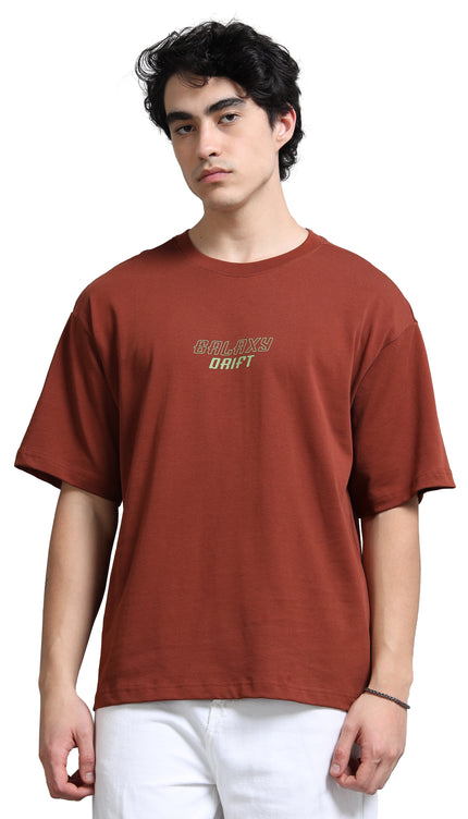 Person wearing a brown t-shirt with text on a white background
